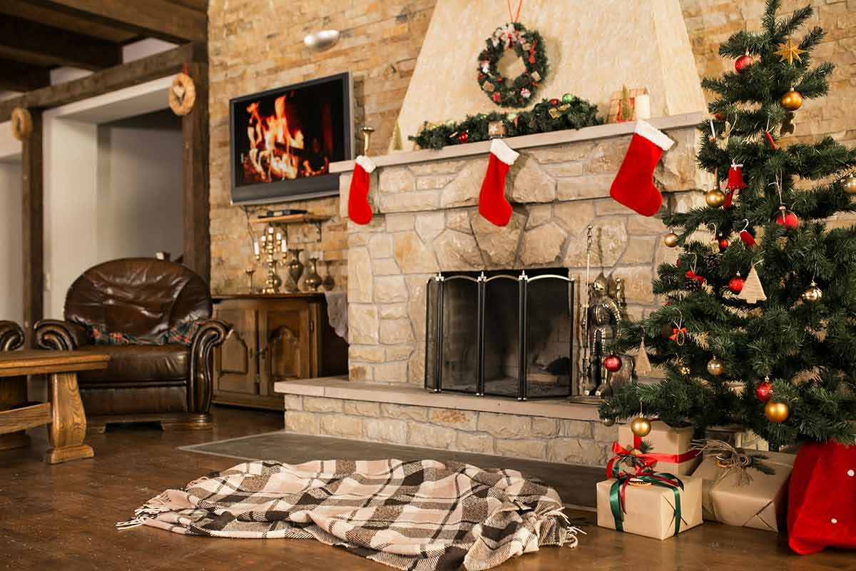 Indoor holiday decor with Christmas tree and fireplace